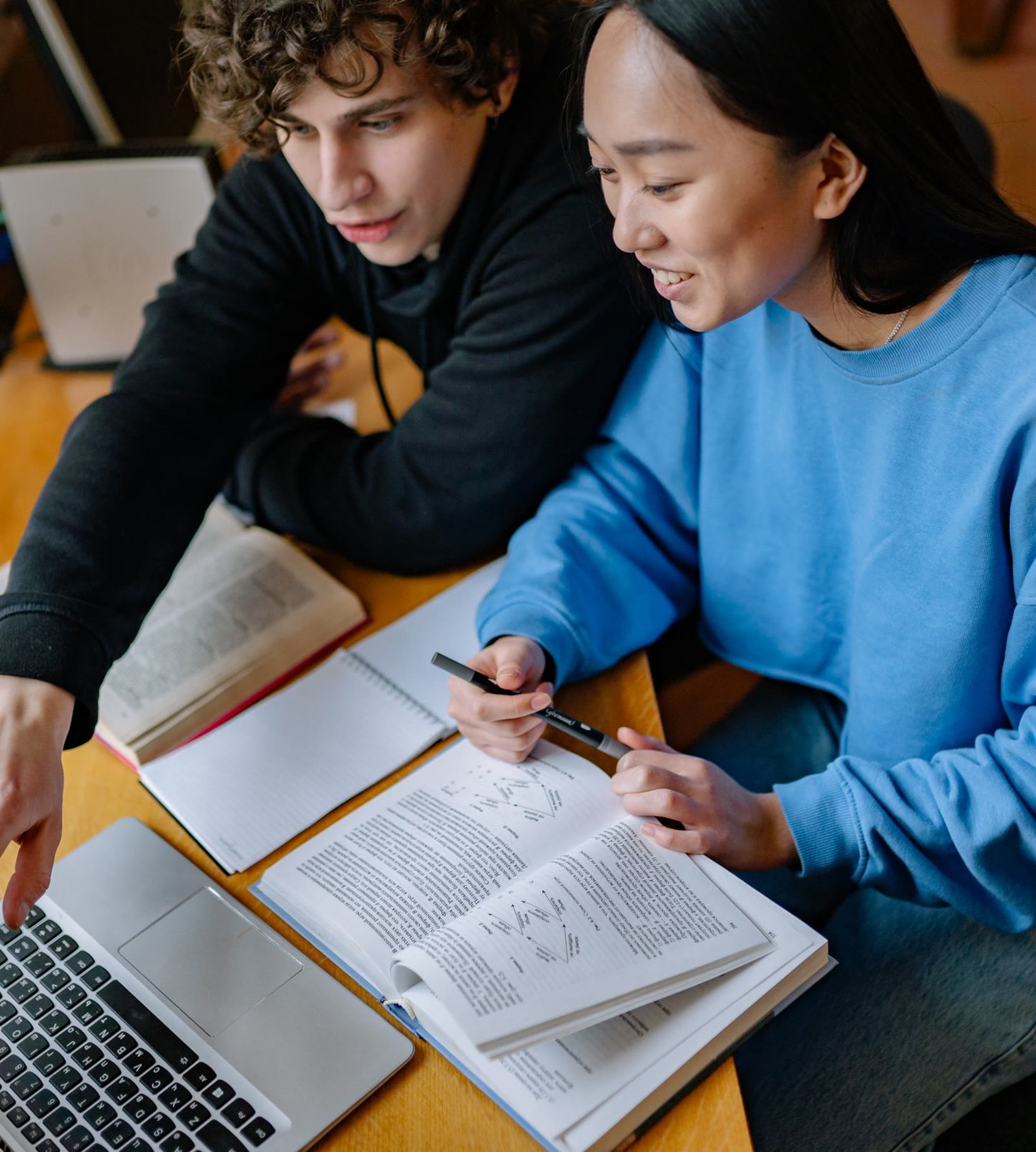 Two students working through the material