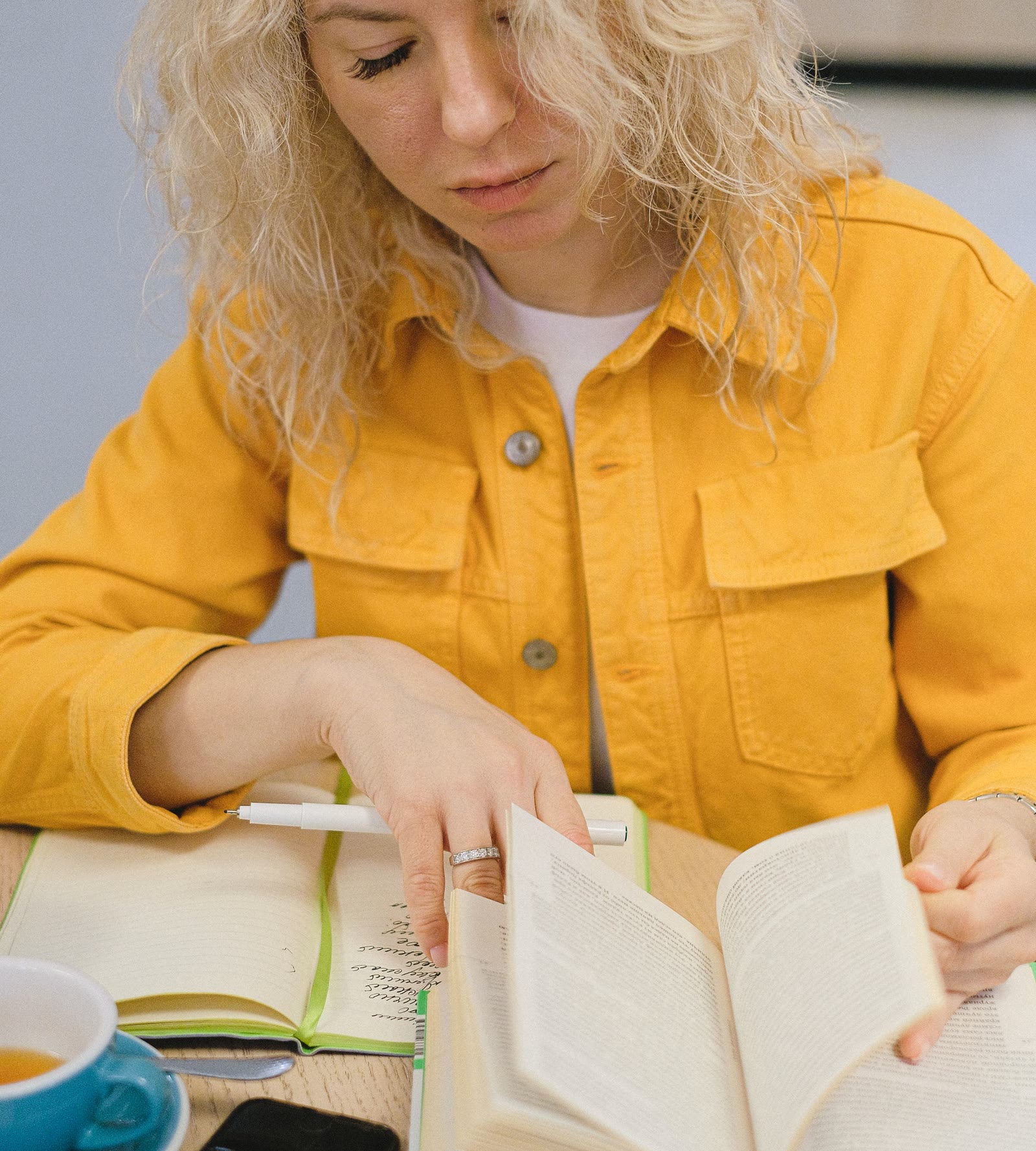 A student photographing a page of working